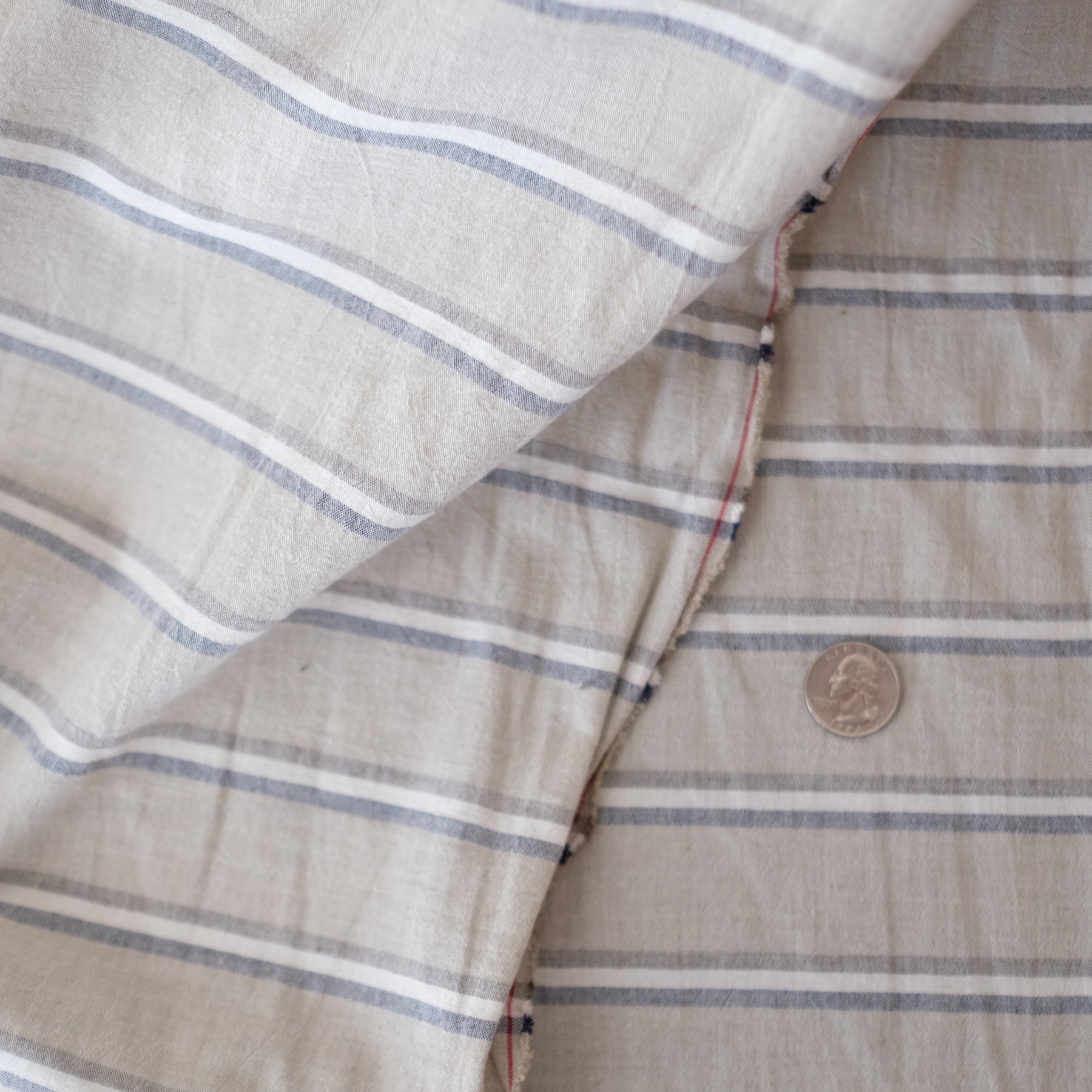 Label: brown with brown, white, and grey stripe